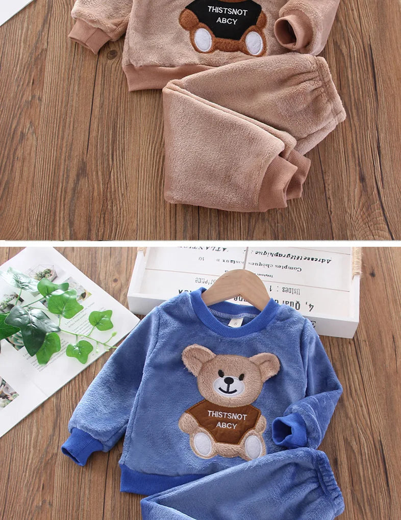 Naptime Cub baby fleece sleepwear set featuring cartoon bear design, perfect for ages 1-2 years, in two cozy colors.