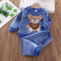 Naptime Cub baby fleece sleepwear set for ages 1-2, featuring a cute bear design in soft blue fabric.