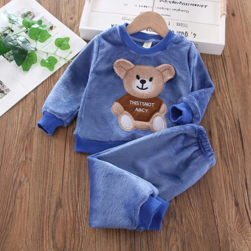 Naptime Cub baby fleece sleepwear set for ages 1-2, featuring a cute bear design in soft blue fabric.